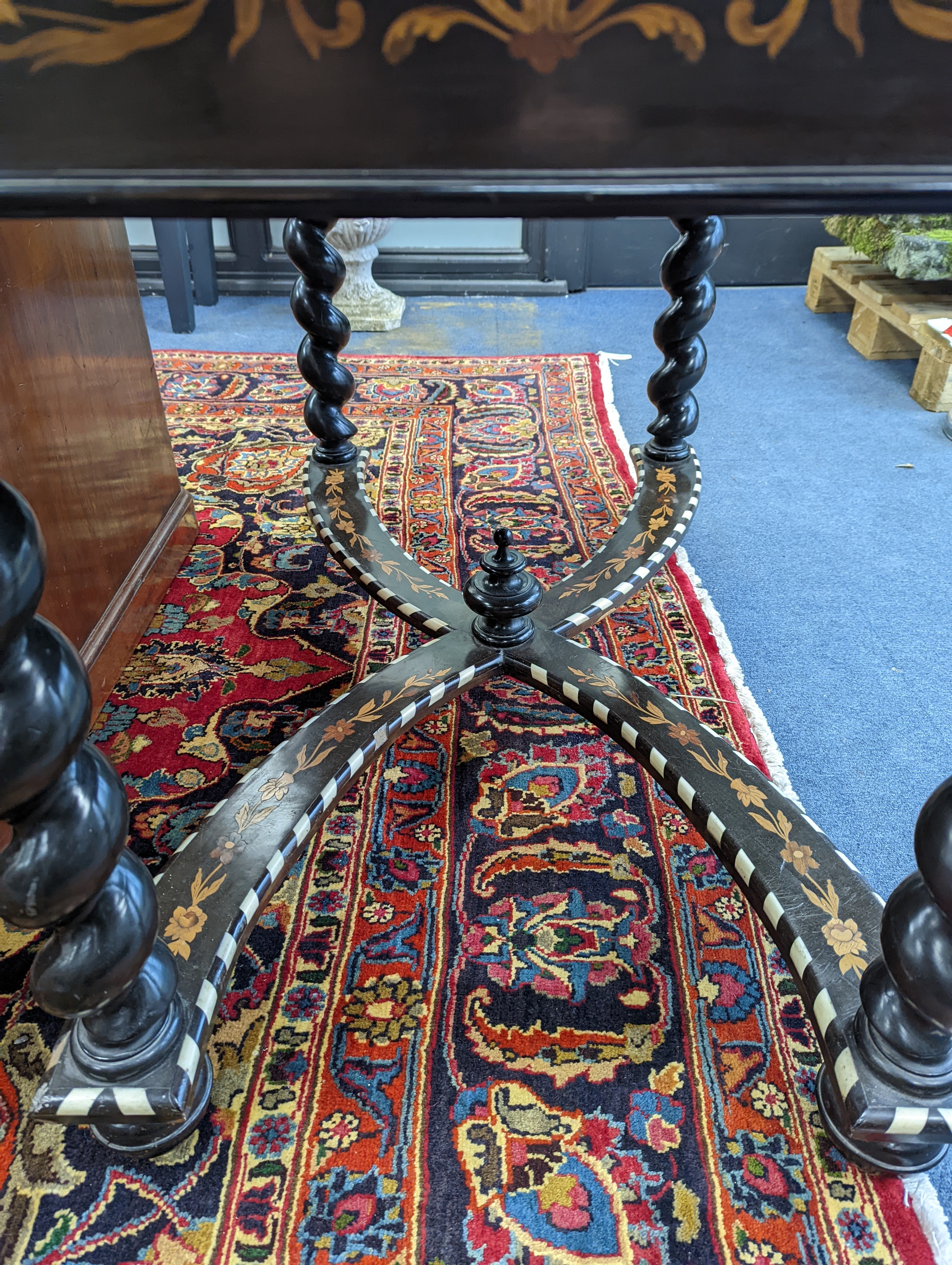 A William and Mary style rectangular marquetry and bone inlaid walnut side table, fitted drawer on ebonised spiral turned under frame with shaped X stretcher width 110cm, depth 67cm, height 78cm